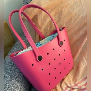 Bright pink beach tote with waterproof liner.